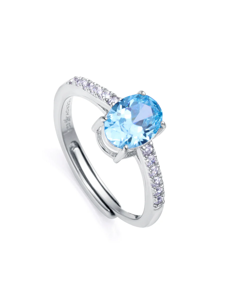 Anillo Clásica de plata de ley con baño de rodio y circonita color aguamarina y blancas